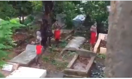 (VIDEO) 'Yahoo Boys' cut bathing soap in a cemetery