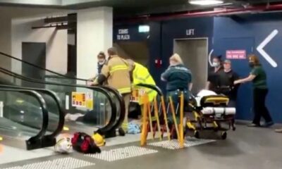 Woman gets trapped on escalator at shopping centre after freak fall (video)