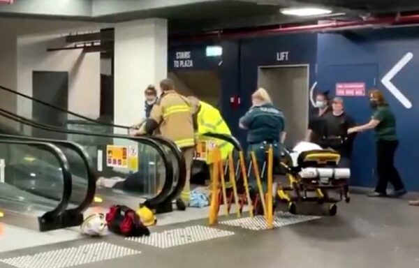 Woman gets trapped on escalator at shopping centre after freak fall (video)