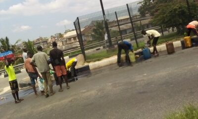 See as area boys scoop fuel as trailer carrying load fall at Ojota Lagos