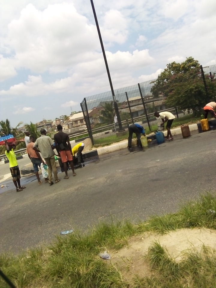 See as area boys scoop fuel as trailer carrying load fall at Ojota Lagos