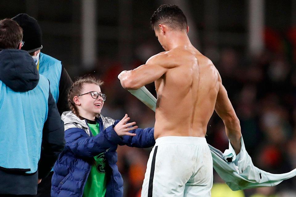 the girl who ran to collect Ronaldo's jersey