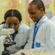 Female Medical Students, Experimenting in the Laboratory.
