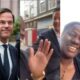 African lady could not believe her eyes as she walk side by side with Netherlands Prime Minister